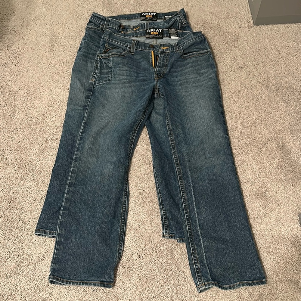Two pair dark wash Ariat men’s jeans